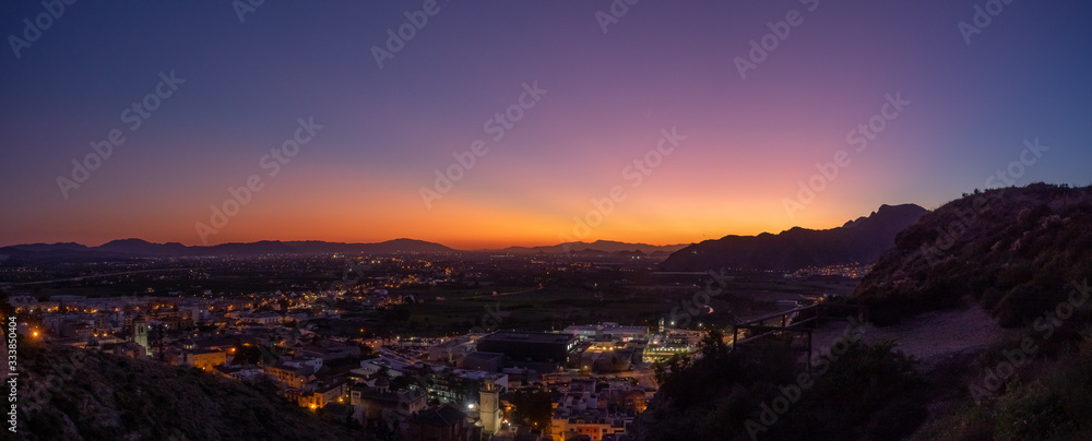 Fototapeta premium Sunset view to the mountains and the center of Orihuela, Spain