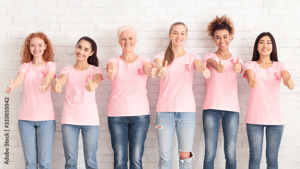 Ladies In Pink T-Shirts Gesturing Thumbs Up, White Background, Panorama