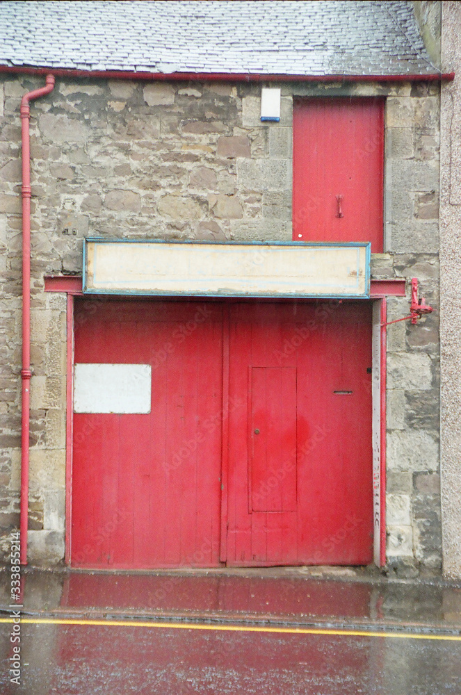 red door with gutter