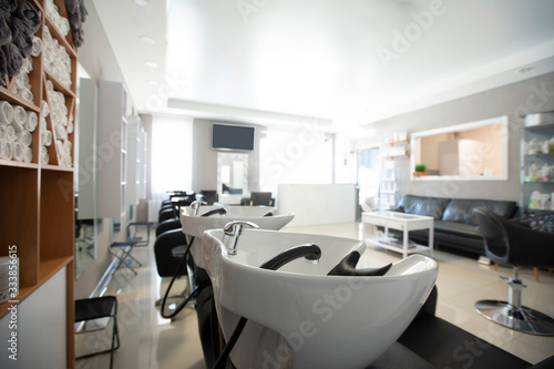 Focus on sink for washing hair. Beauty salon