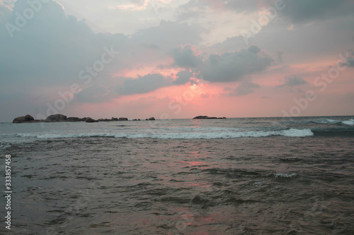 indian ocean at sunset in sri lanka photo