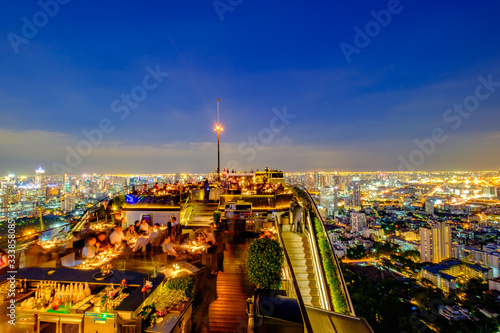 Canvas Print Skyline at sunset from a rooftop bar in Bangkok, Thailand
