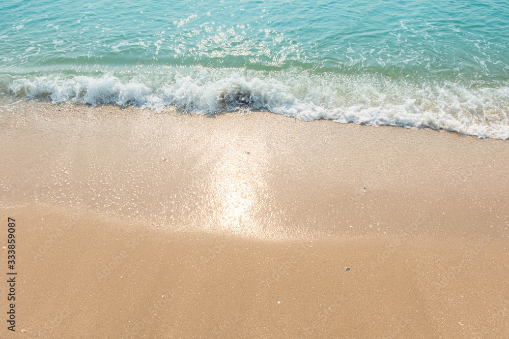 Blue ocean waves Sunlight Reflection Sand Beach background Blue ocean waves Sunlight Reflection Sand Beach background