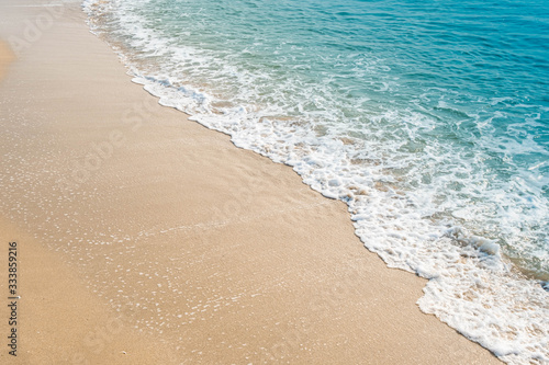 wave of blue ocean on sandy beach. texture Background.