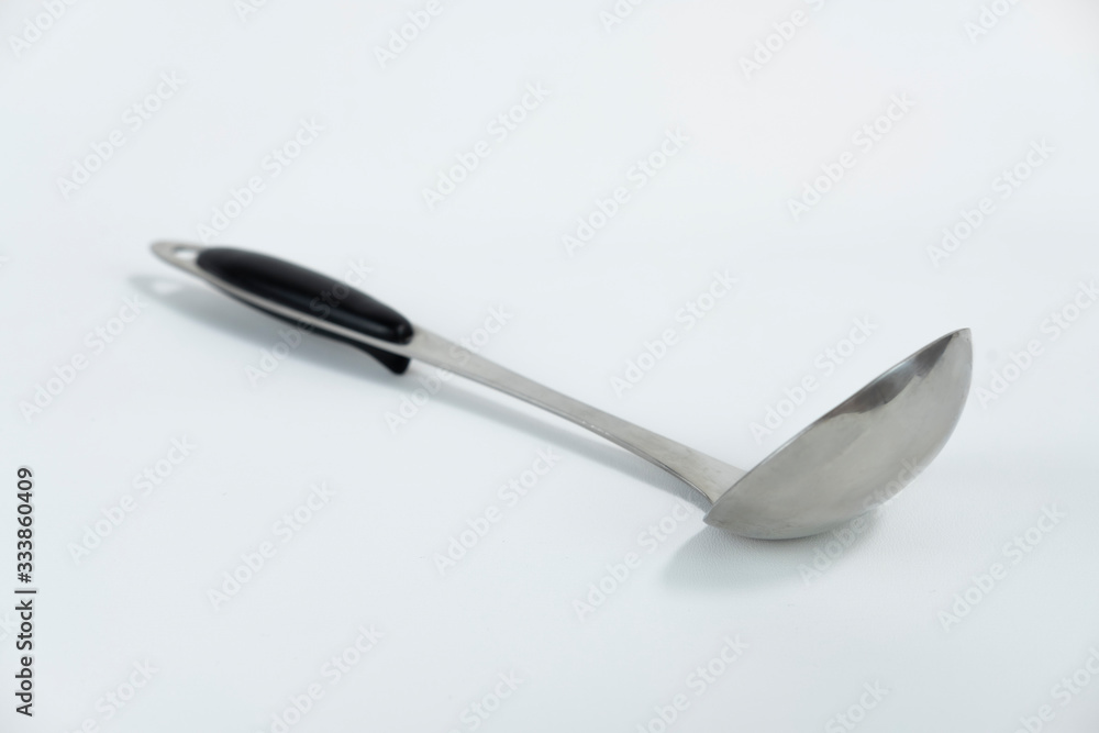 Metal Soup Spoon with black plastic handle isolated on white background Metal Soup Spoon with black plastic handle isolated on white background