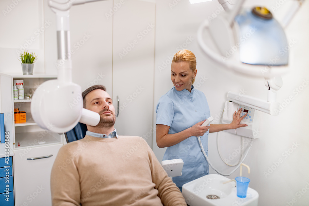 Dentist prepare to make tooth x-ray image for patient in dental clinic Dentist prepare to make tooth x-ray image for patient in dental clinic