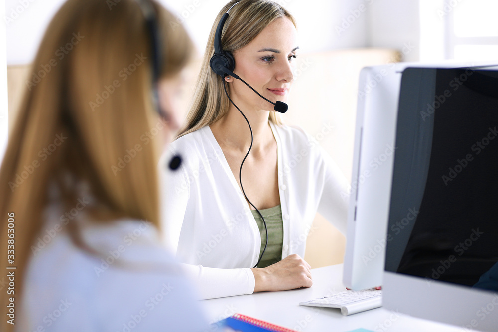 Portrait of call center operator at work. Group of people in a headset ready to help customers. Business concept Portrait of call center operator at work. Group of people in a headset ready to help customers. Business concept