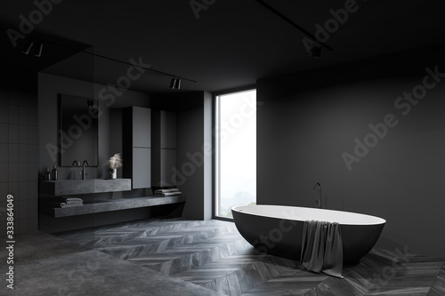 Loft grey bathroom corner with tub and sink