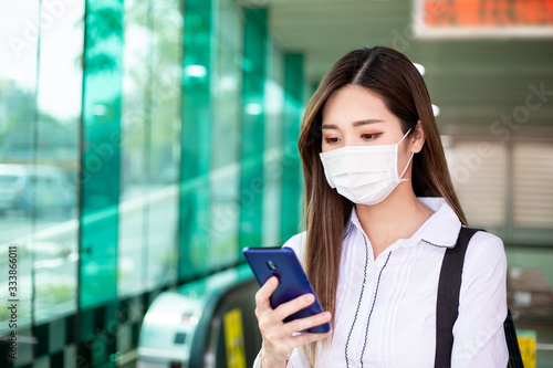 woman use phone with mask