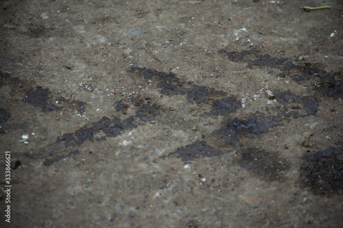 oil marks from car wheels pollution tread