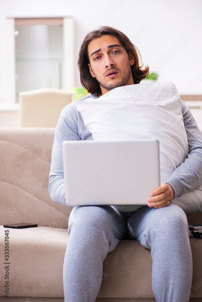 Young male employee freelancer working from home Young male employee freelancer working from home