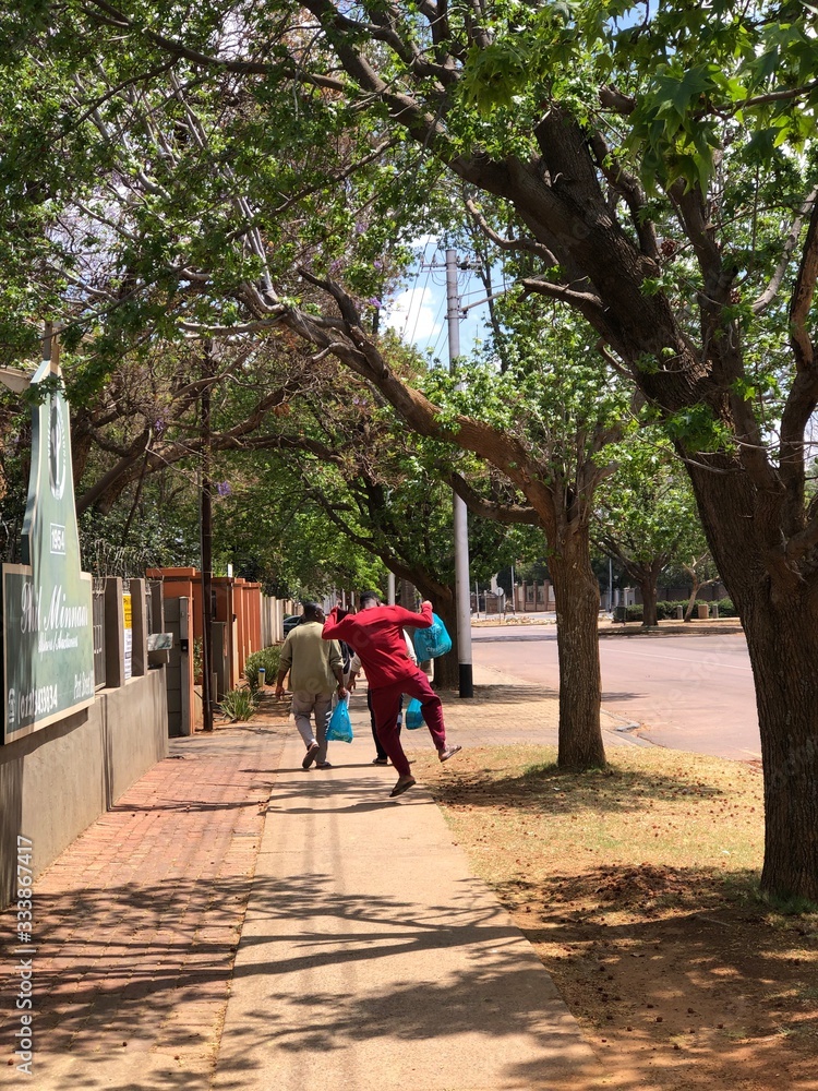 man walking happily on street in the city