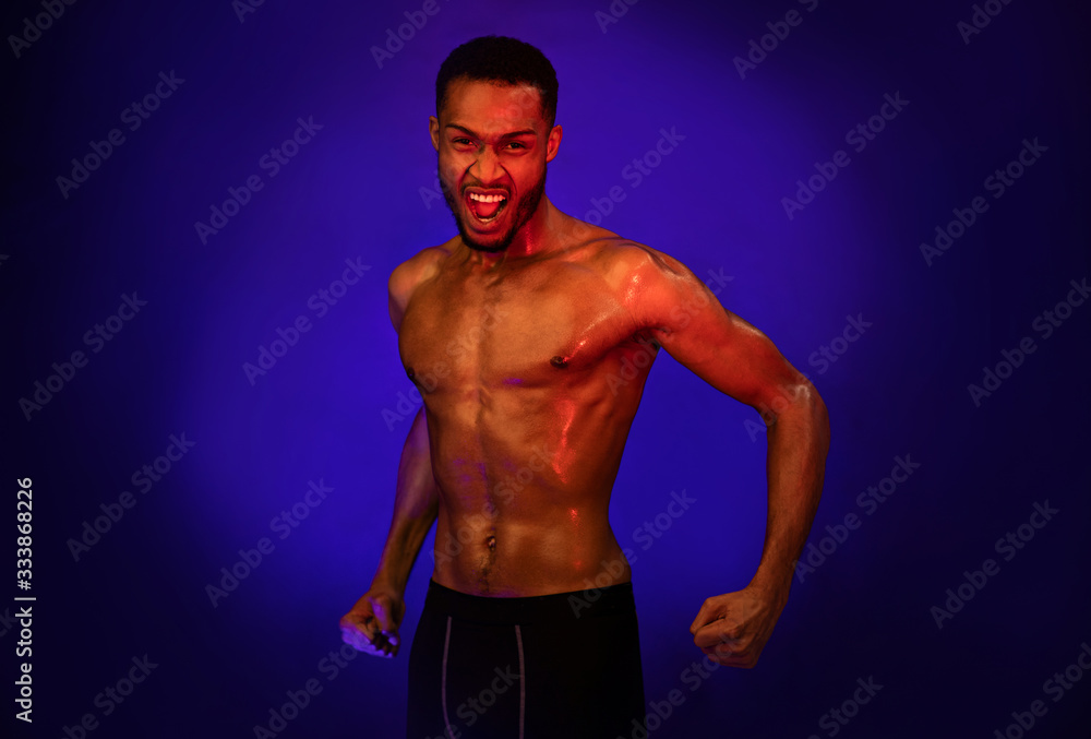 Aggressive Fighter Shouting Clenching Fists Ready To Fight, Studio Shot Aggressive Fighter Shouting Clenching Fists Ready To Fight, Studio Shot