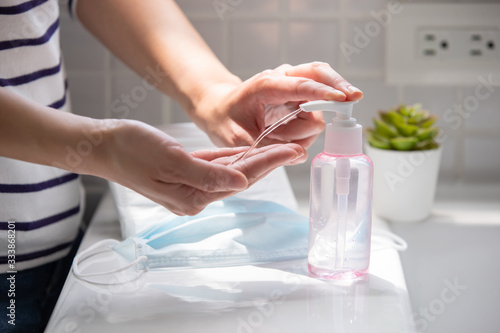 woman use hand sanitizer gel