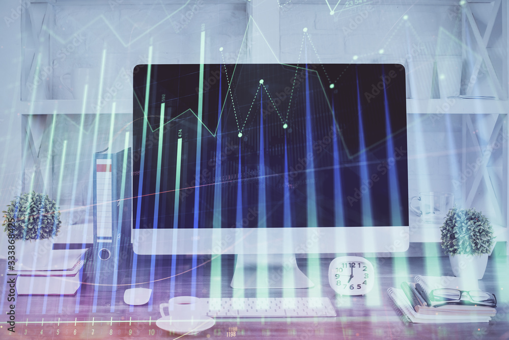 Forex graph hologram on table with computer background. Double exposure. Concept of financial markets. Forex graph hologram on table with computer background. Double exposure. Concept of financial markets.