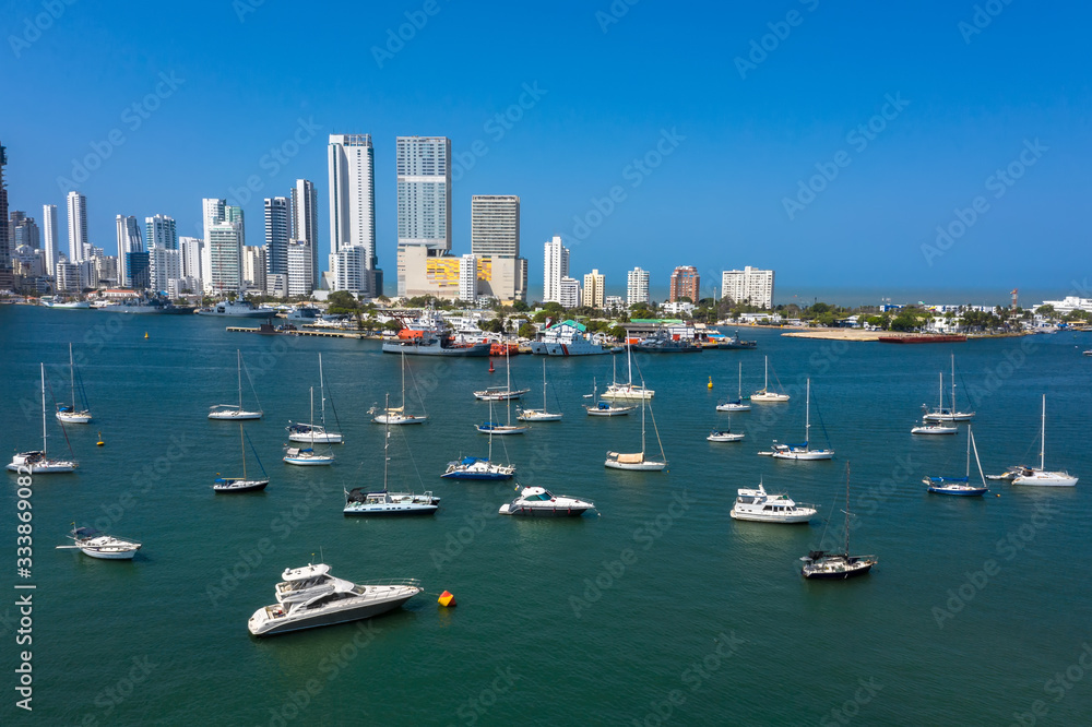 Beautiful yachts drift in the bay. Panorama The Bocagrande district in Cartagena.