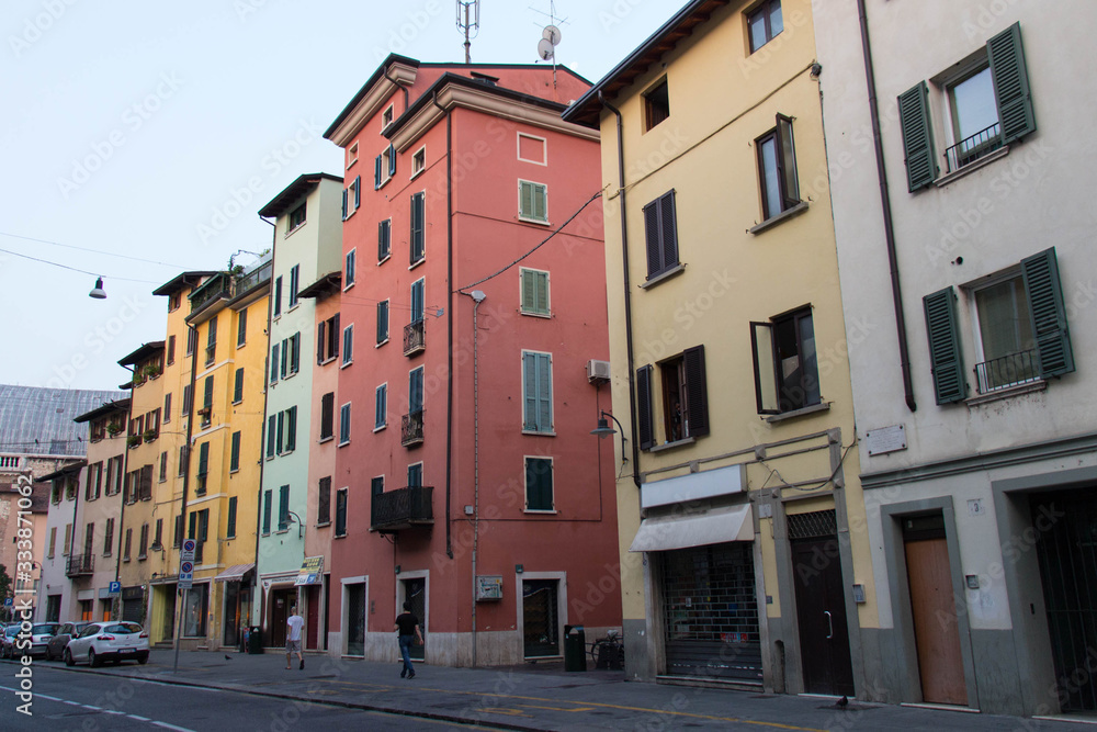 Colored houses in San Faustino street in Brescia, Lombardy, Italy.