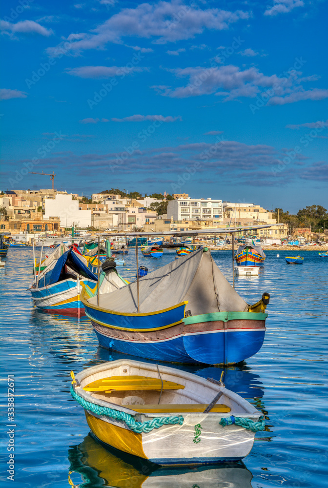 Beautiful view of the traditional eyed colorful boats Luzzu, Malta.