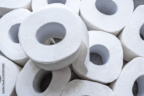 Fotografie Background of white toilet paper rolls . Top view.