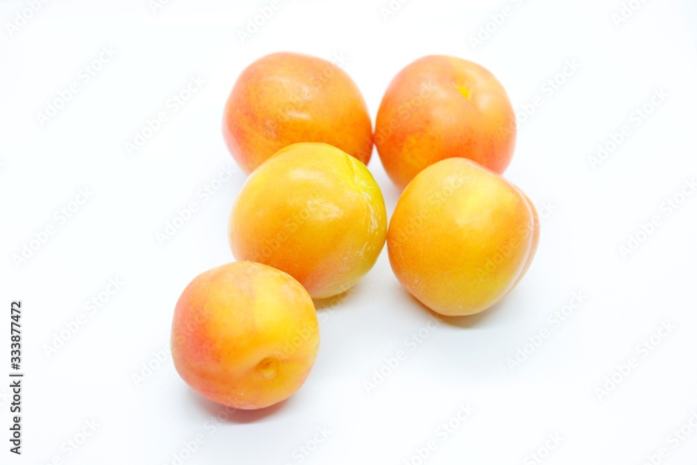 Inculate ripe plums located on a white background Inculate ripe plums located on a white background