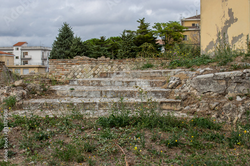 Larino, Campobasso, Roman archaeological site on the modern building background, on a sunny day