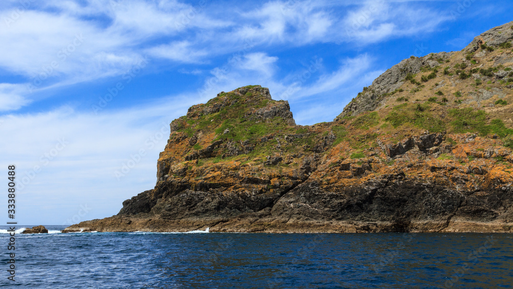Cape Brett in the Bay of Islands, New Zealand. The tip of the cape jutting out into the sea 
