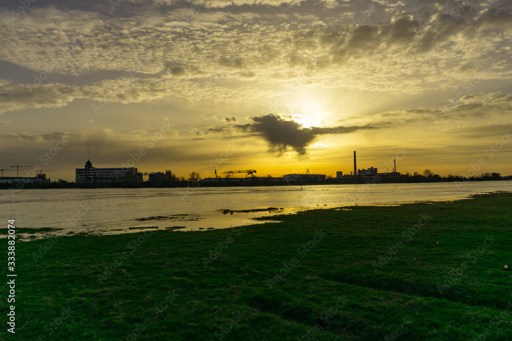 Sunset with clouds and industrial scenery Sunset with clouds and industrial scenery