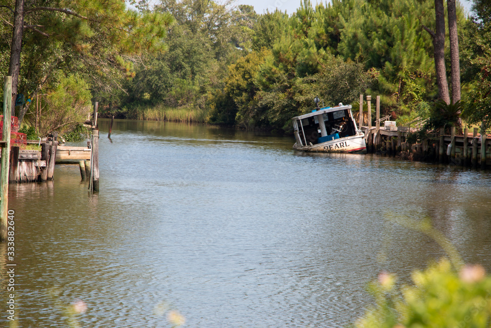 Plash island bon secour river and creeks with trees and half sunken boat Plash island bon secour river and creeks with trees and half sunken boat