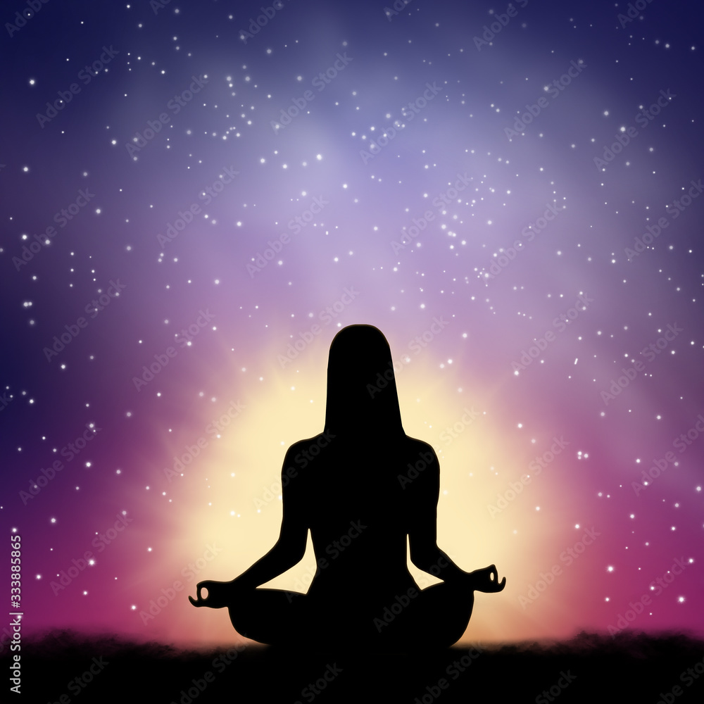 Silhouette of woman sitting in lotus position