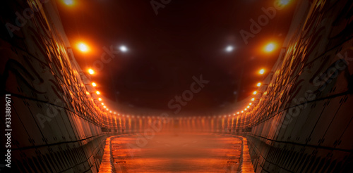 Empty background scene. Dark street reflection on wet asphalt. Rays of neon light in the dark, neon figures, smoke. Background of empty stage show. Abstract dark background.