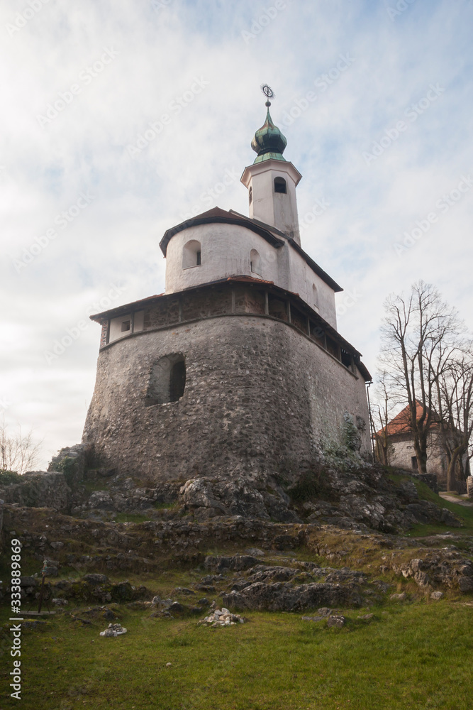 Mali grad or Small castle in Kamnik, Slovenia. One of the most famous landmarks in the old city center. Church build on top of a small hill in Kamnik.
