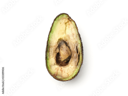 Foto Rotten overripe halved avocado isolated on white
