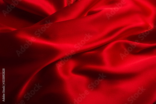 Red silk or satin luxury fabric texture can use as abstract background.