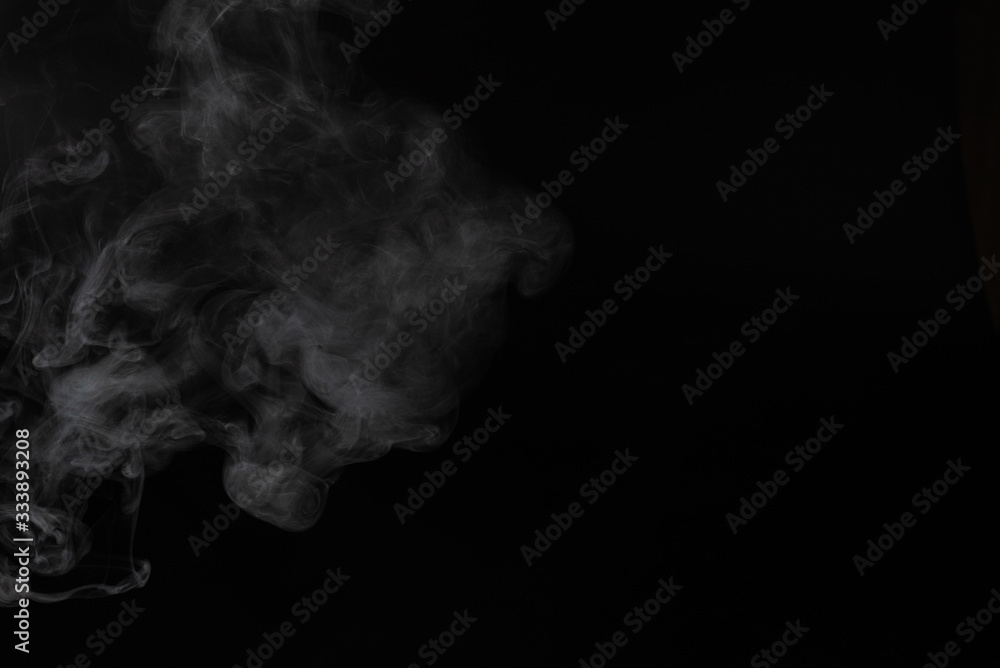 White steam on a black background. White steam on a black background.
