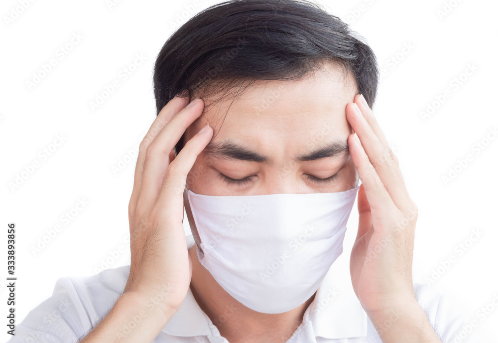 Closeup man wearing face mask for protect air polution or virus covid 19 with headache on white background, health care and medical concept Closeup man wearing face mask for protect air polution or virus covid 19 with headache on white background, health care and medical concept