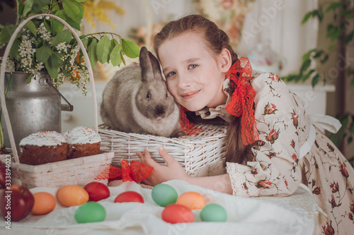 little girl with rabbit  in the kitchen,  Easter holiday