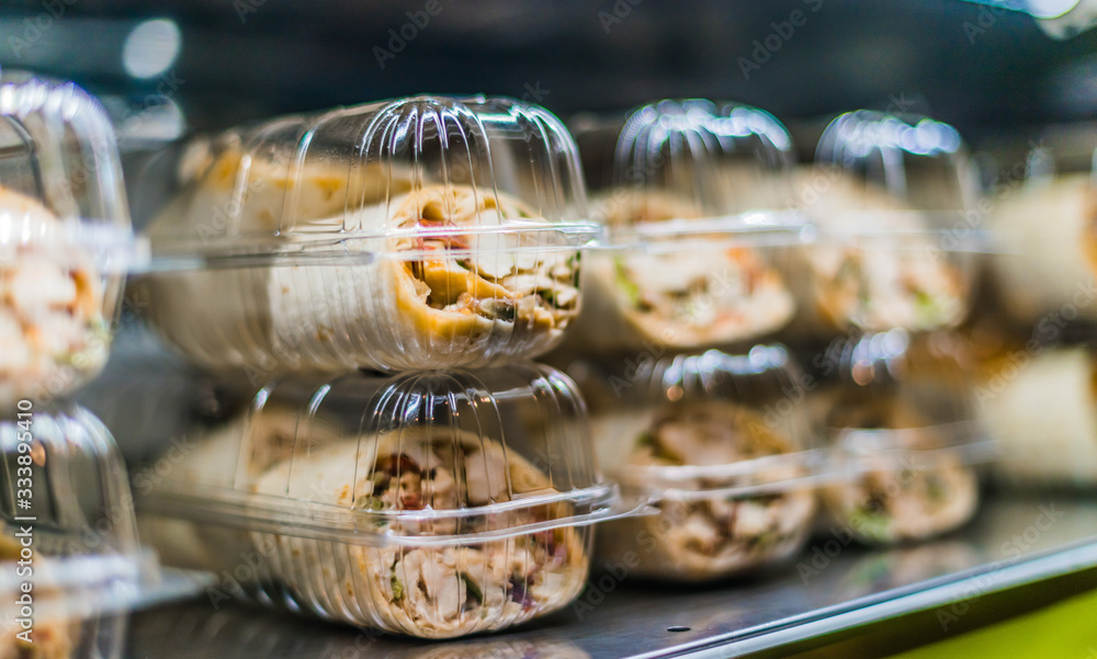 Prepackaged sandwiches displayed in a commercial refrigerator Stock
