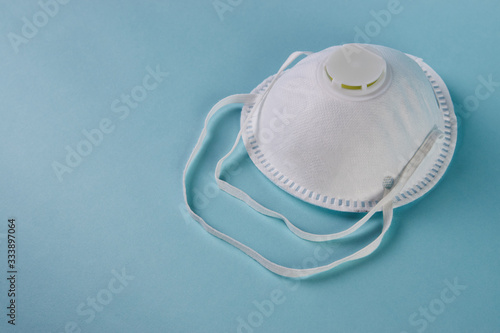 Safety breathing mask on blue background with copy space