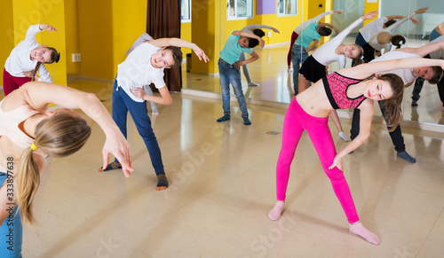 Tweens exercising in choreography class