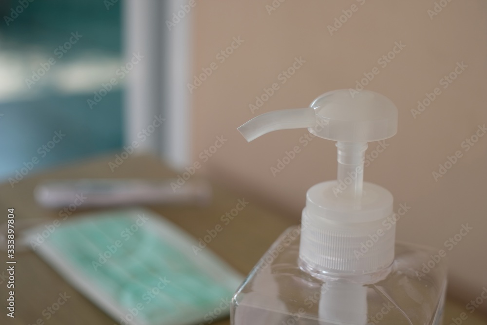 close-up bottle of alcohol gel at store for customers to clean hands close-up bottle of alcohol gel at store for customers to clean hands