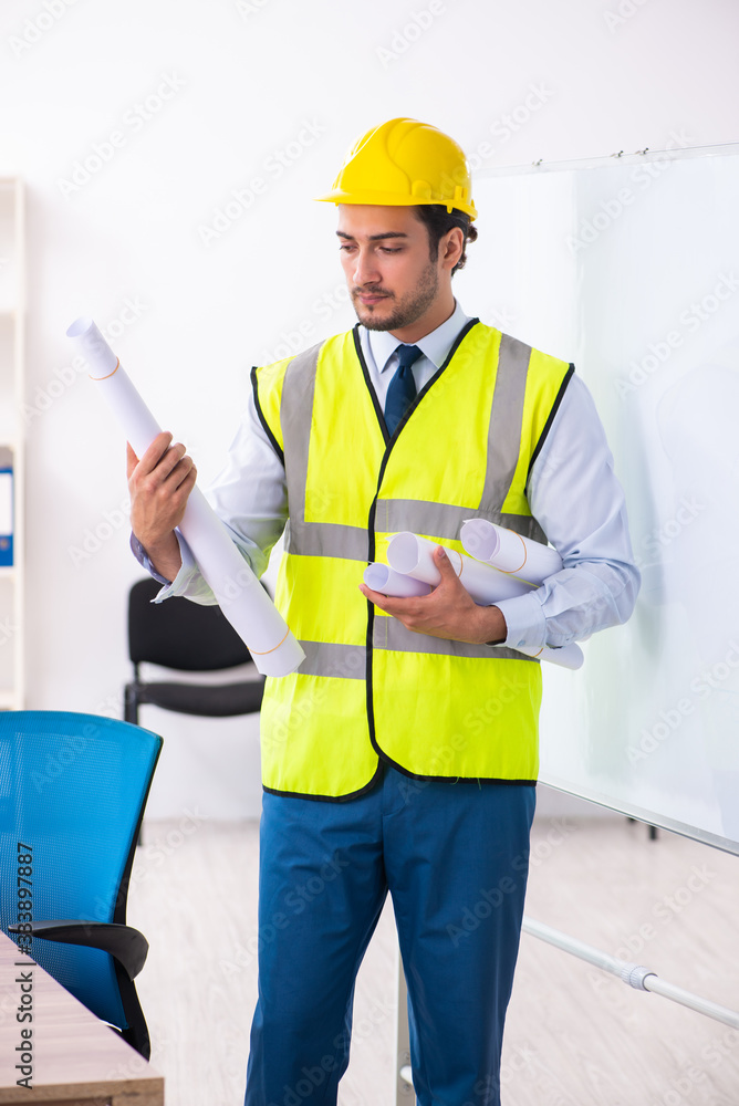 Young male architect in presentation concept Young male architect in presentation concept