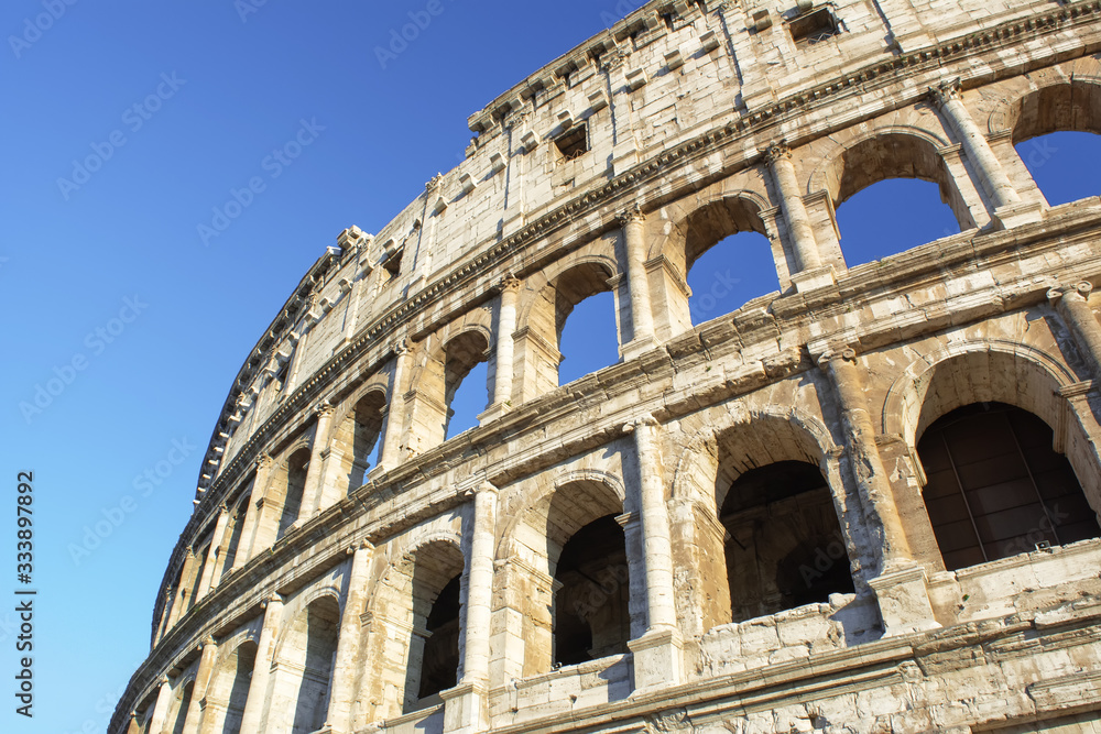 Colosseum at blue sky in Rome, Italy, Europe.