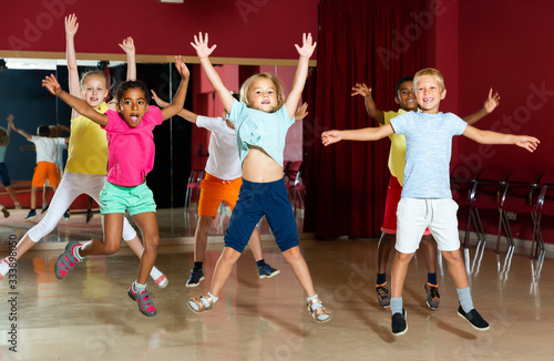 Positive children jumping while studying dance