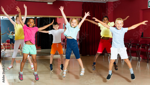 Nice children jumping while studying dance