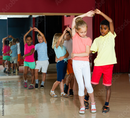 Happy kids dancing salsa dance