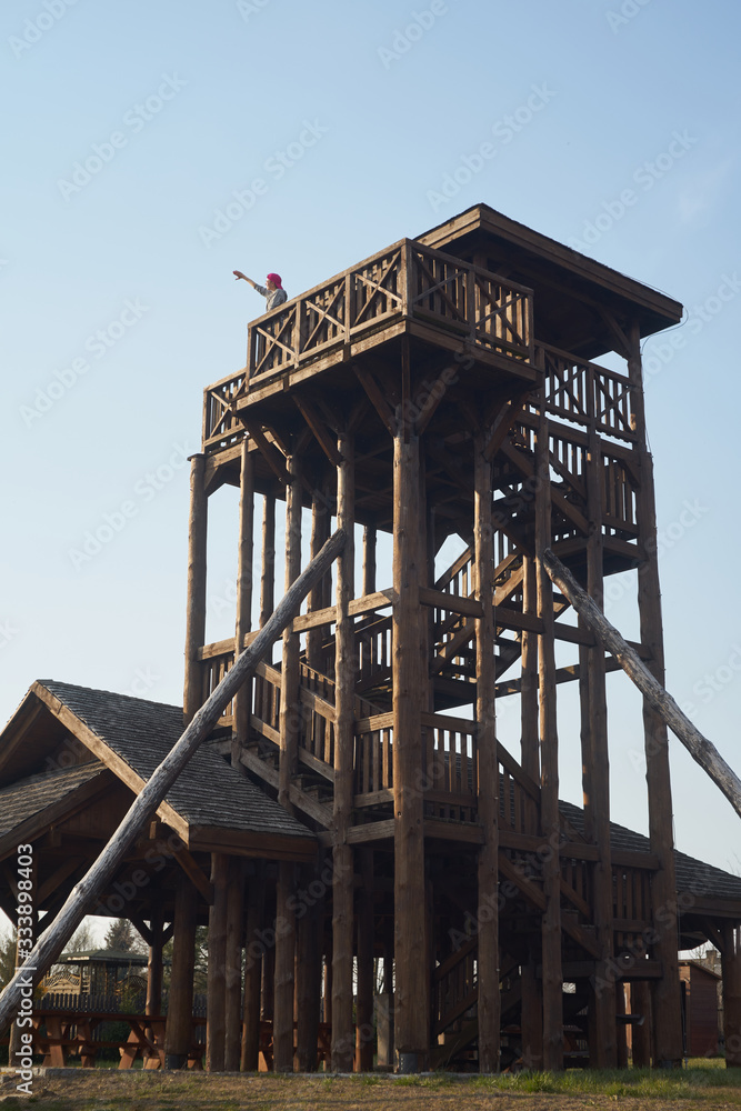 Caucasian man or girl observes sky from observation tower Caucasian man or girl observes sky from observation tower