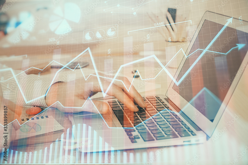 Double exposure of stock market graph with man working on laptop on background. Concept of financial analysis. Double exposure of stock market graph with man working on laptop on background. Concept of financial analysis.