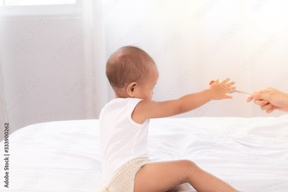 Toddler child refuse, ignore, disgust vegetable or fruit tomato from mother, mom try to practice daughter eat healthy fruit vegetable, kid girl deny healthy food vegetable push hand out of her mouth Toddler child refuse, ignore, disgust vegetable or fruit tomato from mother, mom try to practice daughter eat healthy fruit vegetable, kid girl deny healthy food vegetable push hand out of her mouth
