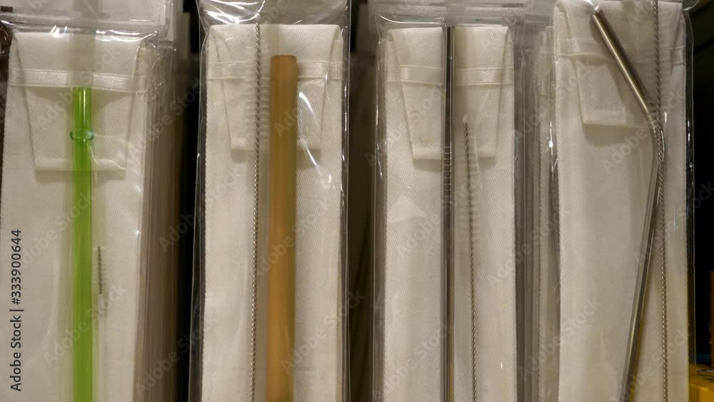 Assortment of Reusable Eco Friendly Straw for Beverages of Steel, Bamboo and Plastic. Sets of Organic Drinking Tubes in the Supermarket. Cocept of Zero Waste Assortment of Reusable Eco Friendly Straw for Beverages of Steel, Bamboo and Plastic. Sets of Organic Drinking Tubes in the Supermarket. Cocept of Zero Waste