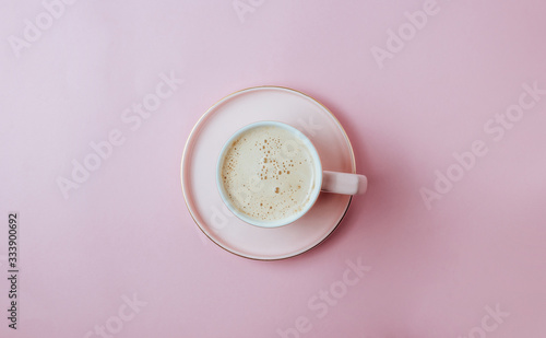 Coffee cup on pastel pink background. Minimal concept. Flat lay, top view